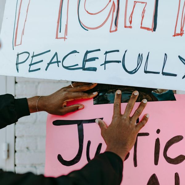 Person meditating peacefully in a calm environment.